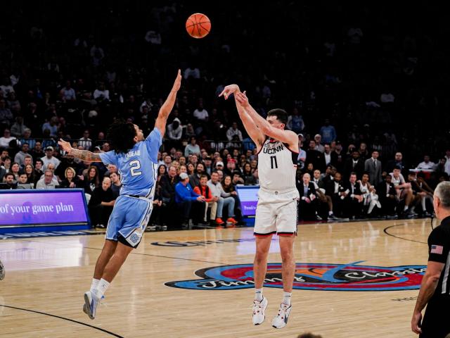 In the Jimmy V Classic at MSG, No. 5 UConn defeats No. 9 North Carolina 87-76 with Spencer scoring 23 points. This game was covered by WRALSportsFan.com.
