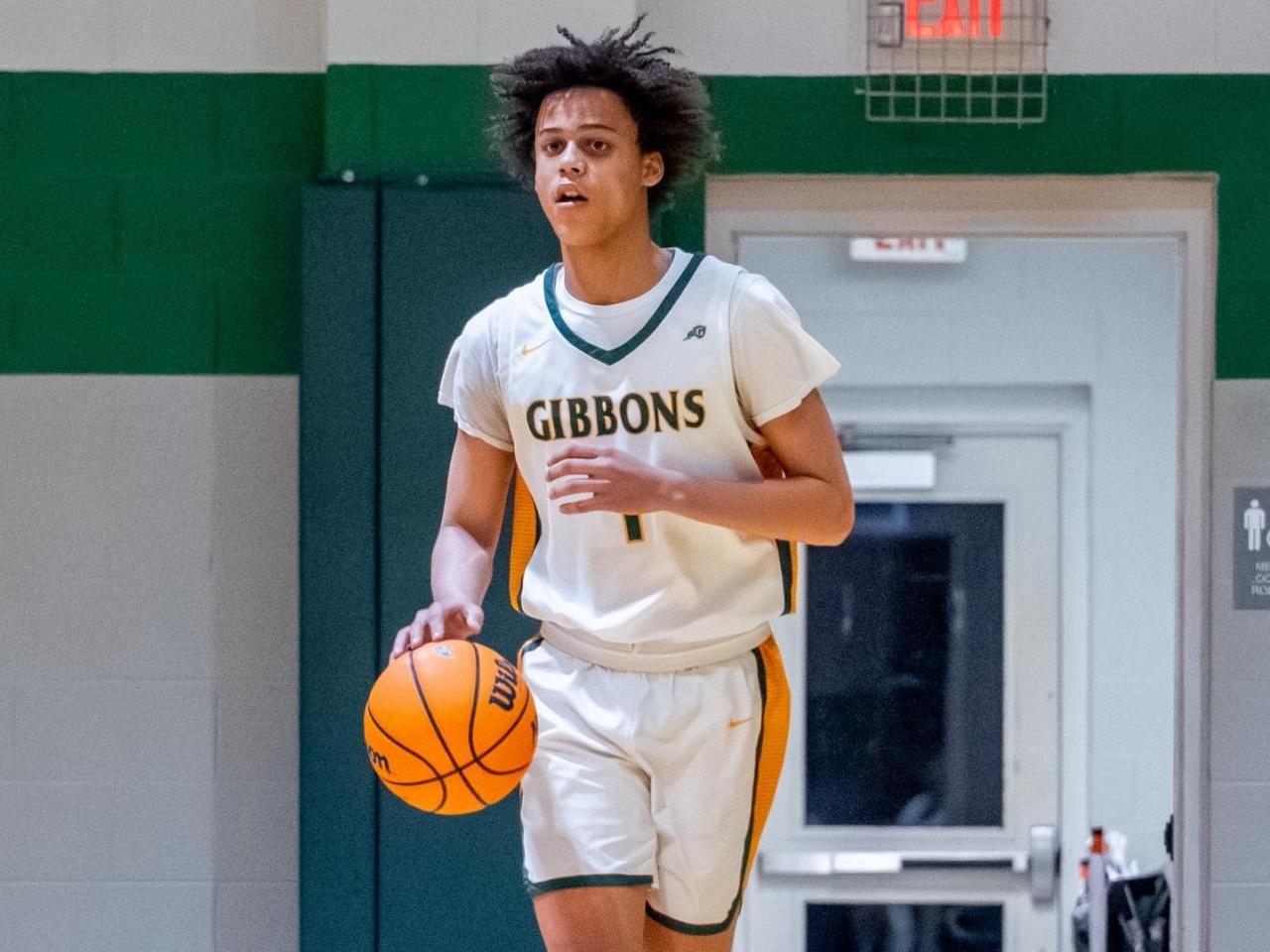 Cardinal Gibbons' boys defeat Chapel Hill, ending their 10-game winning streak in overtime.