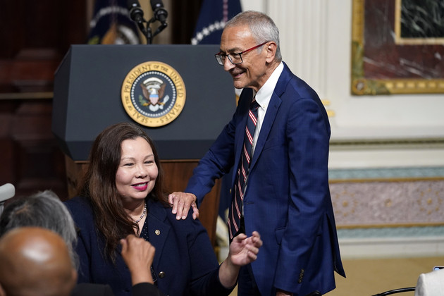 John Podesta, White House senior adviser for clean energy innovation, greets Sen. Tammy Duckworth (D-Ill.). 