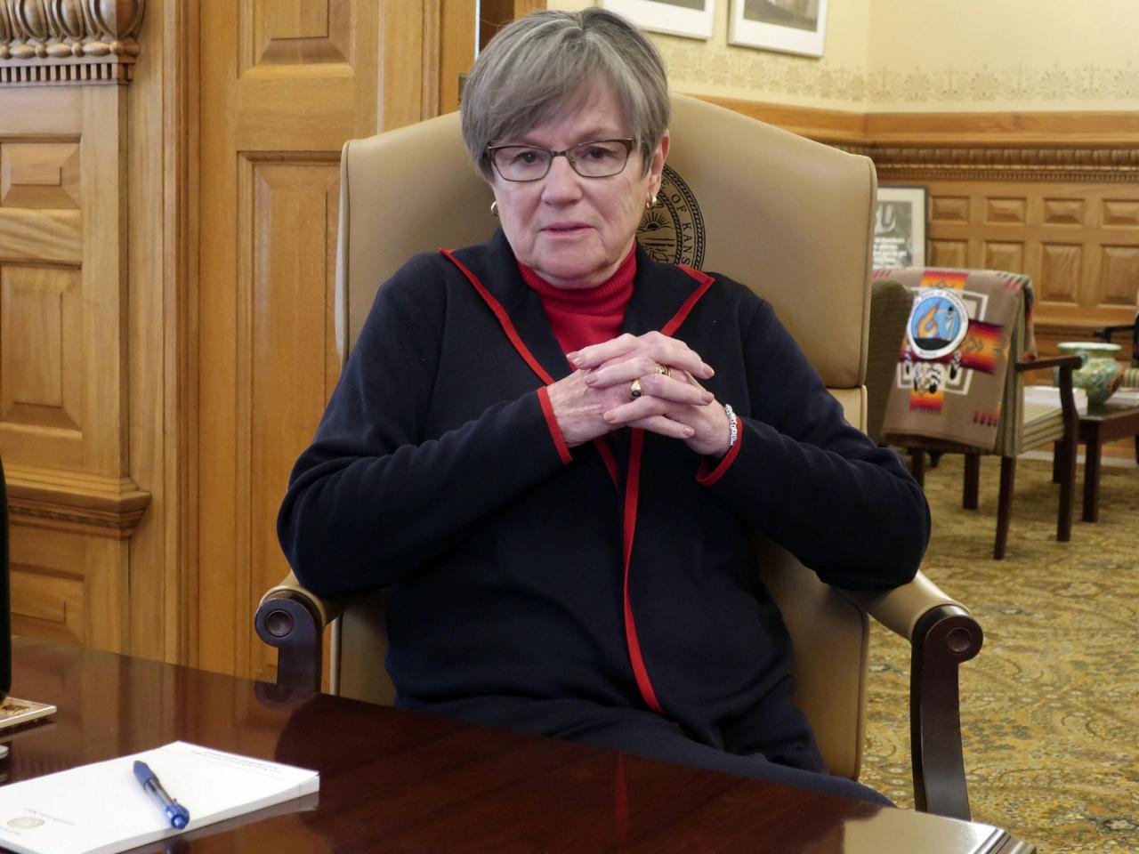 The governor of Kansas is embracing politics and going against her brand in a push to expand Medicaid.