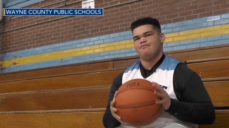 A member of the Wayne County basketball team who serves as their manager had a memorable moment when they suited up and scored for the team, bringing pride to both the team and school.