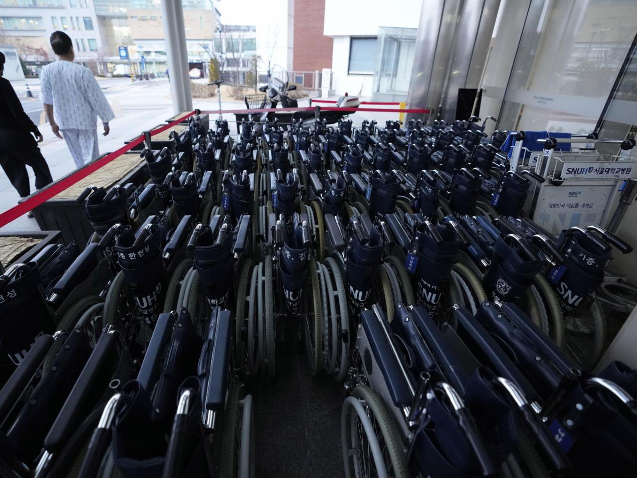 Doctors in South Korea are going on strike to protest against a push for increased medical training, leading to the cancellation of scheduled surgeries.