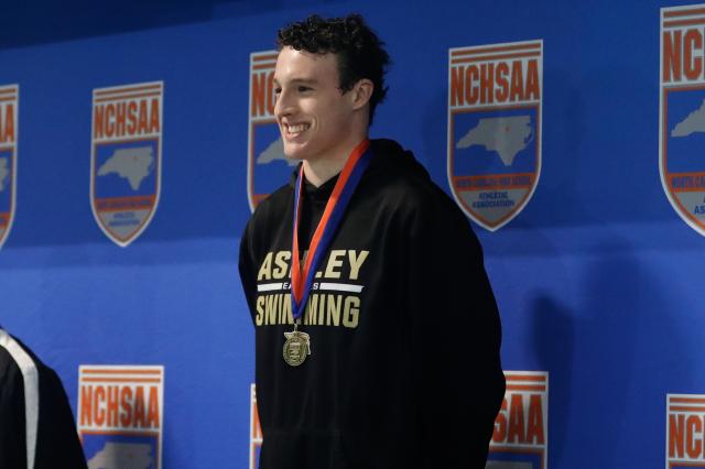 Marvin Ridge dominated the 4A boys swimming competition, securing the title with ease. Ashley's Setzer also made her mark by setting two new records.