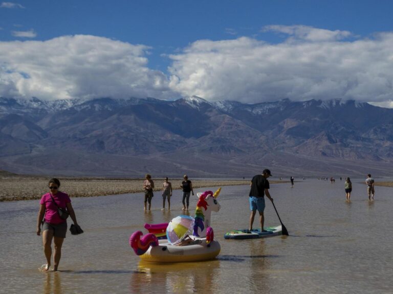 Paddlers on kayaks navigate through Death Valley following a replenishment of a lake in one of the driest areas on Earth.