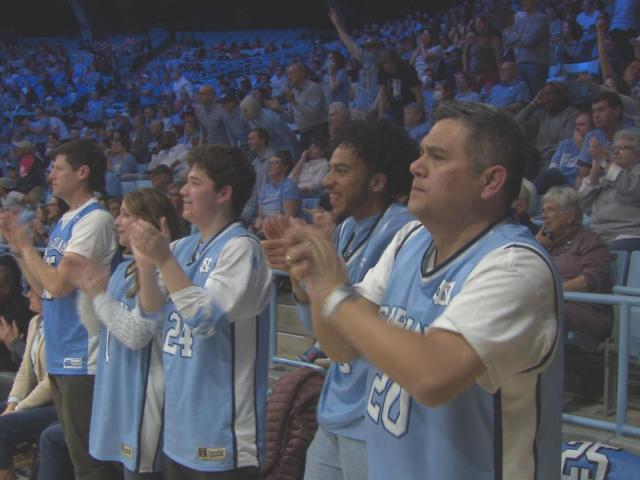 Lou Patalano's family and friends wear jerseys reflecting each UNC women's lineup on the court :: WRALSportsFan.com