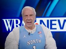 Former North Carolina men's basketball coach Roy Williams appeared in the WRAL commercial for Super Bowl 57.