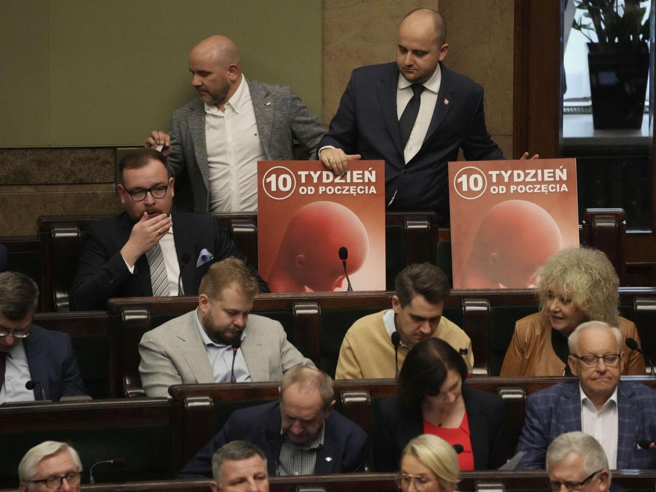 Polish lawmakers vote to move forward with work on lifting a near-total abortion ban