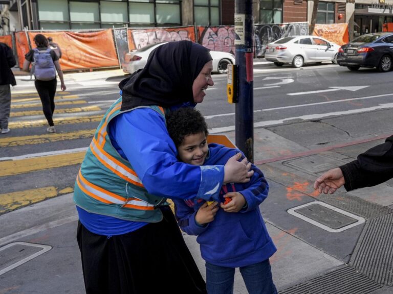 With a vest and a voice, helpers escort kids through San Francisco’s broken Tenderloin streets