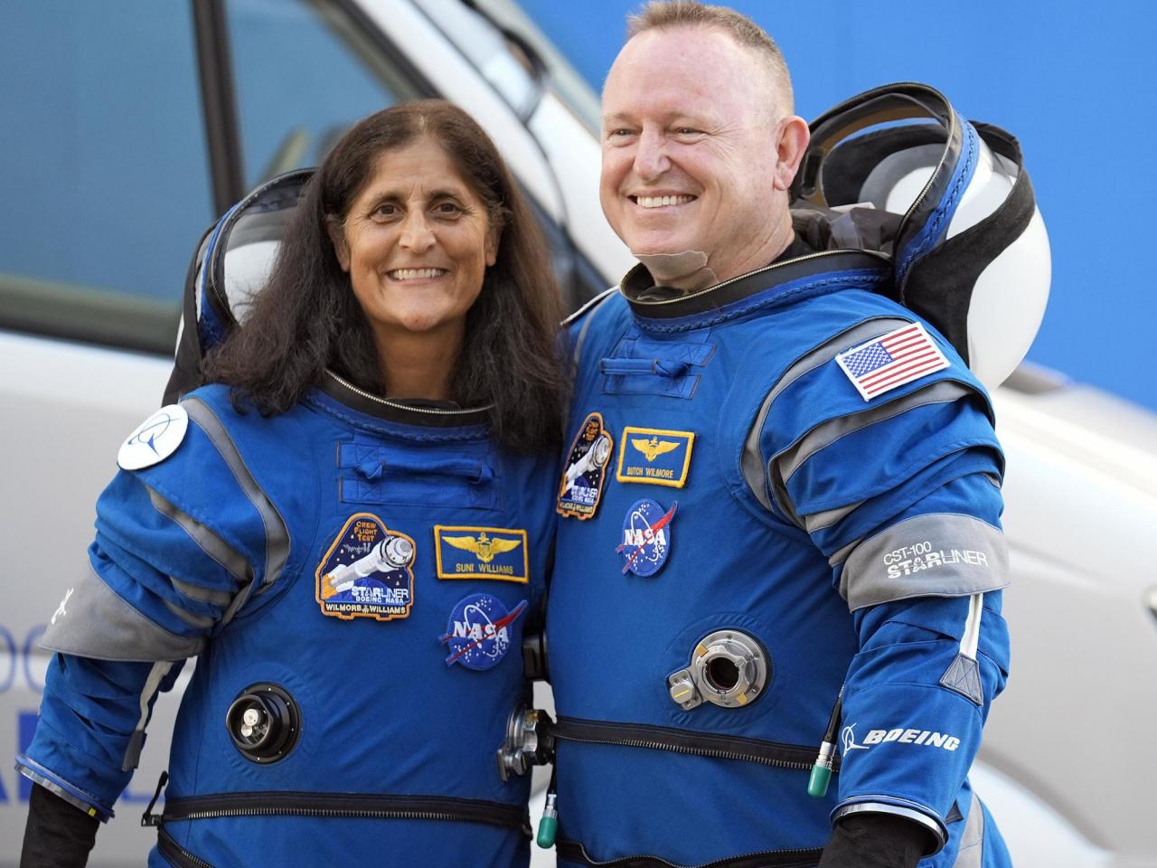 NASA astronauts who will spend extra months at the space station are veteran Navy pilots