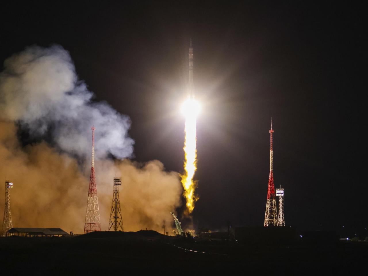 A Soyuz craft with 2 Russians and 1 American docks at the International Space Station