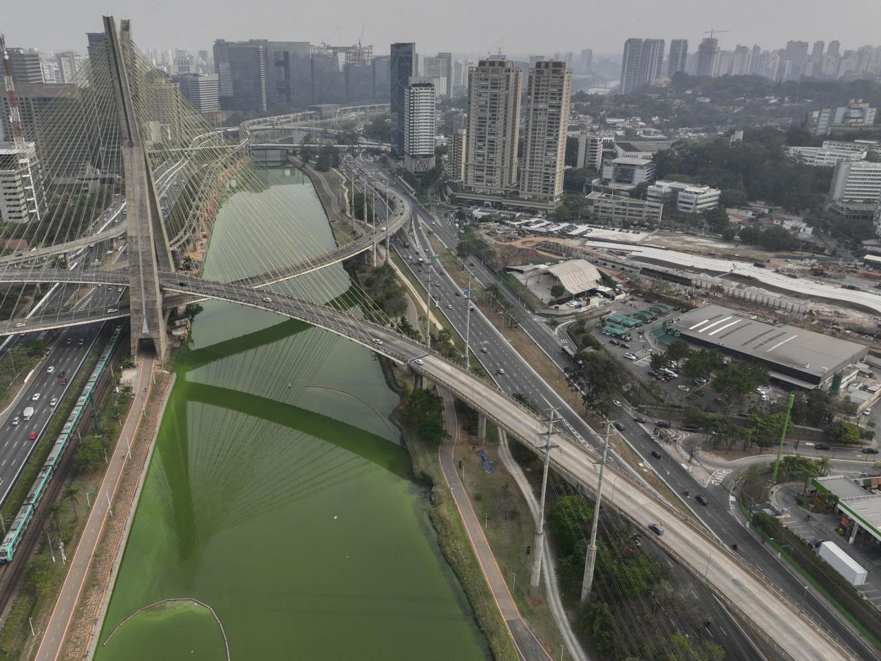 Drought is making Sao Paulo's river emerald green while smoke turns its skies grey