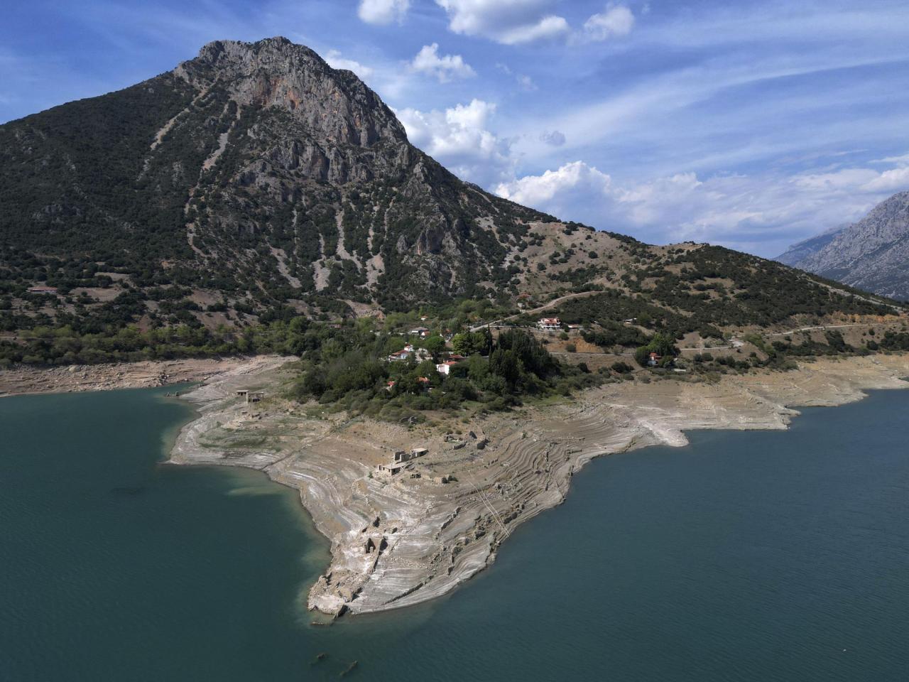 Ruins of a long-sunken Greek village emerge as drought saps a vital reservoir