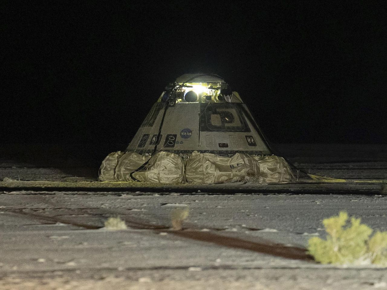 Two astronauts are left behind in space as Boeing's troubled capsule returns to Earth empty