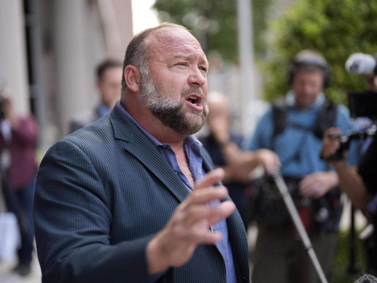 Company affiliated with Alex Jones seeks to disqualify The Onion's auction bid on Infowars