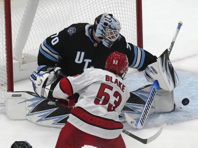 Utah scores 3 goals in 2 1/2 minutes in 3rd, Vejmelka has 49 saves in 4-1 win over Hurricanes :: WRALSportsFan.com