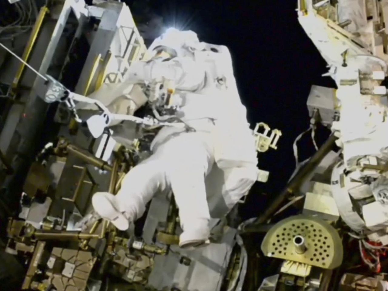 NASA's stuck astronaut steps out on a spacewalk after 7 months in orbit