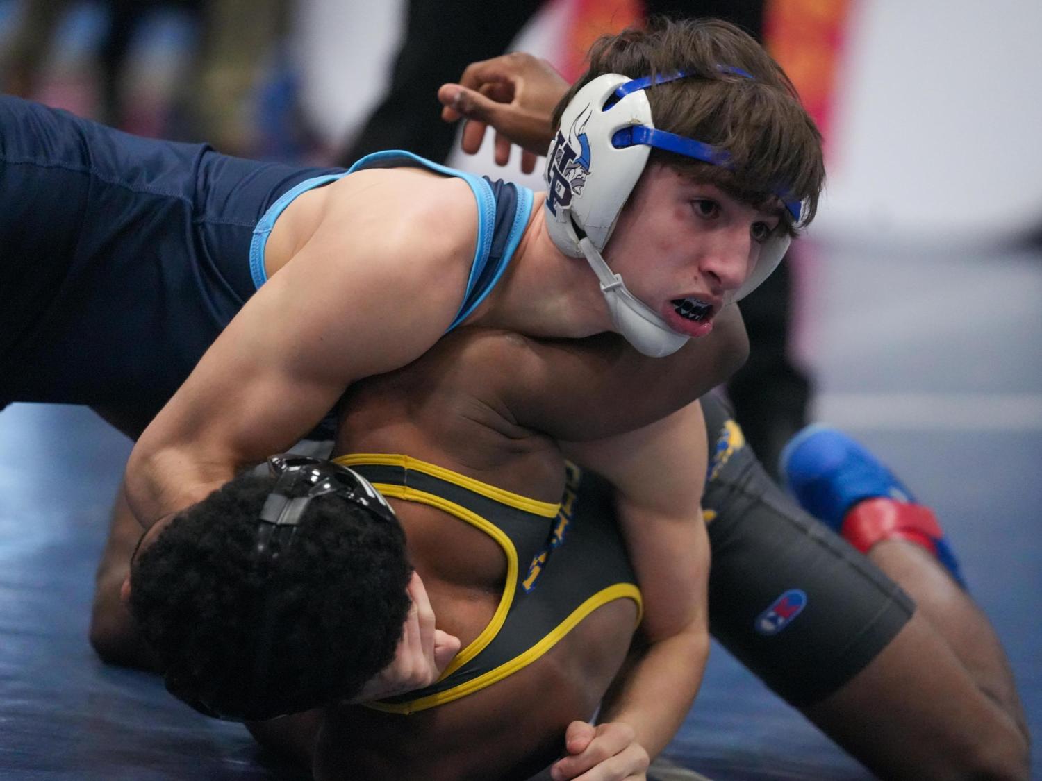 Championship matchups set for dual-team wrestling; see scores from 3rd round and regional final