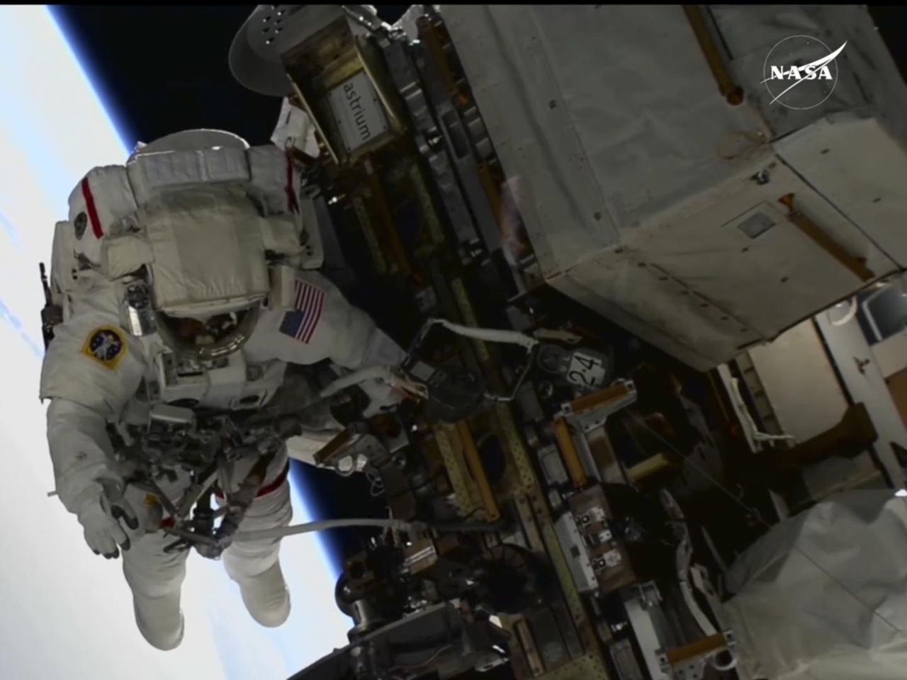 NASA's 2 stuck astronauts take their first spacewalk together