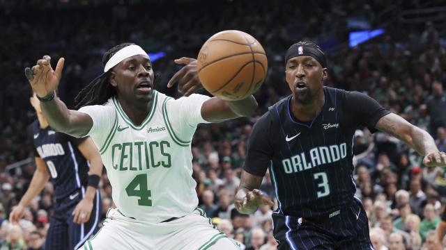 Boston Celtics' Jrue Holiday (4) looses control of the ball against Orlando Magic's Kentavious Caldwell-Pope (3) during the first half in game 1 of a first-round NBA playoff basketball series Sunday, April 20, 2025, in Boston. (AP Photo/Michael Dwyer) Magic_Celtics_Basektball_71800